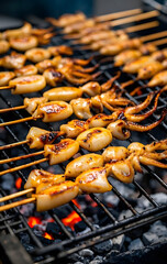 A grilled squid on a grill with a hot charcoal.