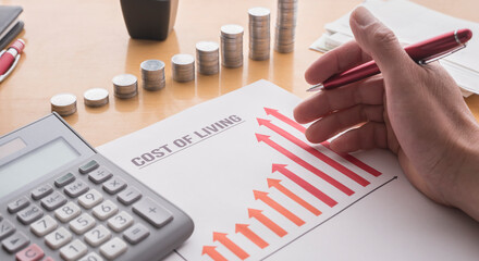 A paper showing a graph of the rising cost of living