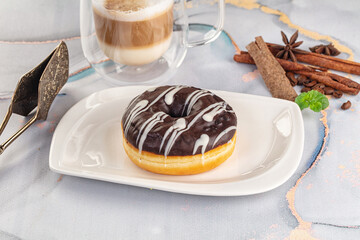 Delicous sweet donut with chocolate glaze