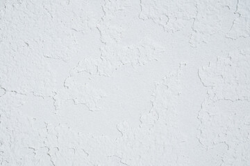 White plaster wall with rough textured surface closeup..
