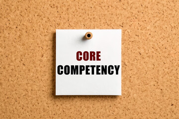 Core competency text on post-it paper pinned on the bulletin cork board