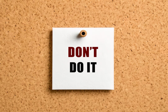 Don't do it text on post-it paper pinned on the bulletin cork board