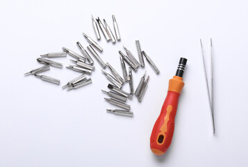Set of removable metal bits with screwdriver