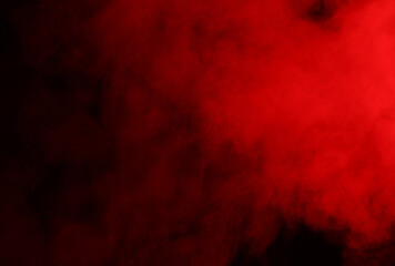 Steam or smoke in red neon light on black background