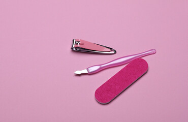Nail care tools, manicure set on pink background. Flat lay. Top view