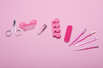 Nail care tools, manicure set on pink background. Flat lay. Top view