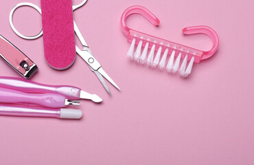 Nail care tools, manicure set on pink background. Flat lay. Top view