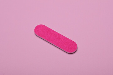 Nail file on a pink background