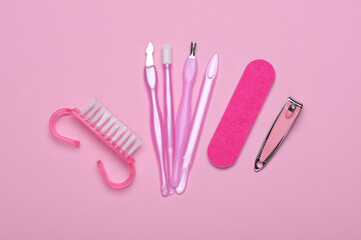 Nail care tools, manicure set on pink background. Flat lay. Top view