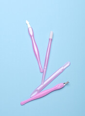 Nail care tools, manicure set on blue background. Flat lay. Top view
