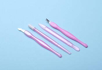 Nail care tools, manicure set on blue background. Flat lay. Top view