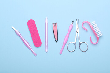 Nail care tools, manicure set on blue background. Flat lay. Top view