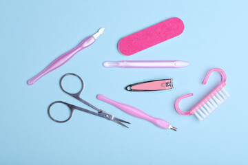 Nail care tools, manicure set on blue background. Flat lay. Top view