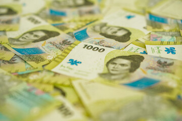 A stack of thousand rupiah banknotes, Indonesian money. suitable for background, finance, banking, cash, savings.