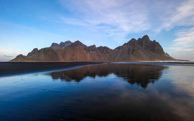 Fototapeta premium Vestrahorn Mountain Reflected in Black Sand Beach, Iceland