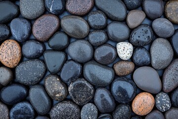 Smooth Stones: A close-up view of smooth stones creates a captivating texture, each stone a unique shape and shade, forming a harmonious blend of natural elements, evoke the sense of tranquility.