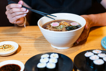 Delicious Ramen and Sushi on a Wooden Table