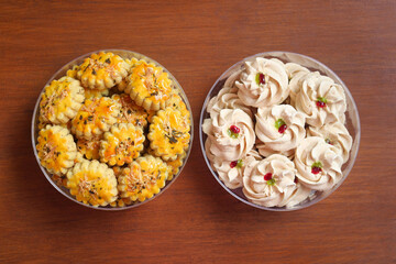 Two bowls of homemade cookies, cheese sago cookies and kastangel cookies served to celebrate Idul Fitri or Eid al Fitr. Various snacks treat during Eid al-Fitr celebration. Indonesian food traditional