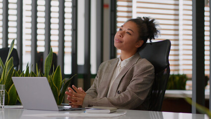 Female employer ethnic woman African American girl businesswoman planning work at desk thinking...