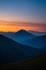 mountains in the distance with a sunset in the distance