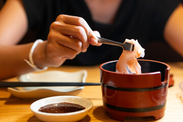 Enjoying Sushi with Chopsticks