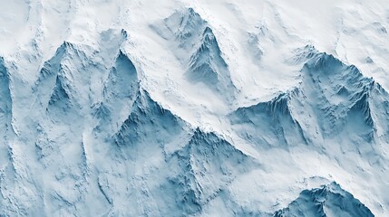 Obraz premium Aerial View of Rugged SnowCapped Mountain Peaks and Ridges in Winter Landscape