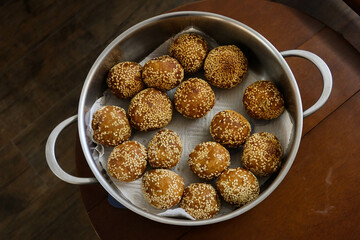 close up of many Chinese traditional festival snacks deep fried Sesame Ball (Jiandui) stuffed with...
