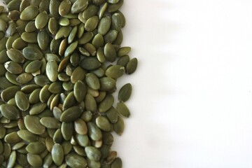 Green Pumpkin Seeds with white background, superfood, High fat, protein, minerals