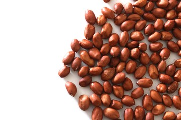 Close up of a pile of pea nuts, with white background, High fat, protein, minerals