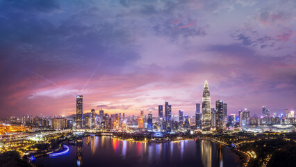 Fototapeta premium Stunning Cityscape Panorama at Sunset with Vibrant Colors and Reflections