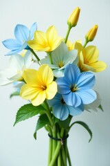Obraz premium Light blue and yellow flowers in a loose, organic bouquet, floral, flower, bloom