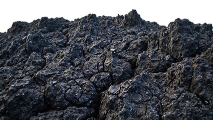 Dramatic close up of jagged volcanic rock with deep fissures standing out against a white background emphasizing its rugged texture