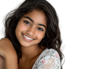 Candid shot of an adorable, fun-loving girl with a bright, infectious smile. Her playful eyes and relaxed pose highlight her attractive, yet down-to-earth personality.