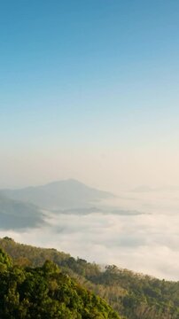 Timelapse of beautiful fog rolling over mountain in Gunung Silipat viewpoint, video Vertical style
