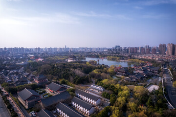 Aerial View of a Modern City Surrounded by Nature and Water