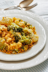 broccoli cauliflower casserole on plate, top view