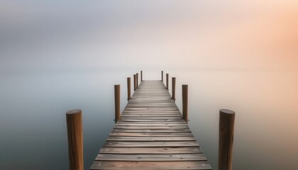 Fototapeta premium Serene Foggy Lake Wooden Pier Long Exposure Photography
