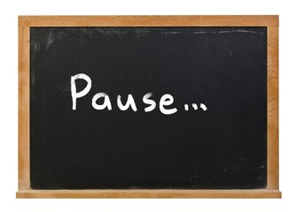 Fototapeta premium Pause written on a black chalkboard in white chalk