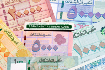 American permanent resident card on a Lebanese money
