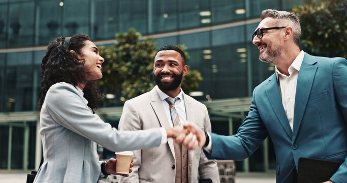 Happy, business people or handshake in city for greeting, meeting or partnership in urban town. Shaking hands, smile or financial advisor with manager for B2B deal, introduction or recruitment offer