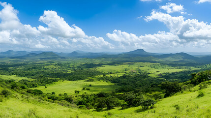 Obraz premium Panoramic View Of Lush Green Valley With Hills And Clouds