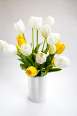 a bunch of Tulips on a shelf. Festive bouquets for women on March 8, bulbous spring flowers