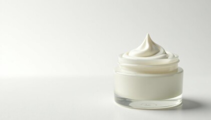 Creamy white lotion in elegant jar on white background, design, natural, texture