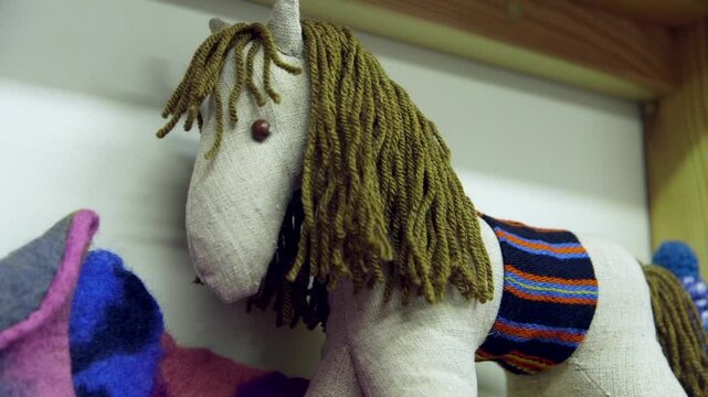 Knitted, Felted and Sewn Rag Dolls on a Shelf in a Children's Room or Shop. Felt, Particularly Made From Wool, is Considered to be the Oldest Known Man-made Textile in Sheep Herding Areas.