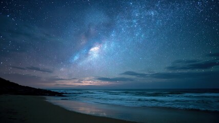A beautiful starry night sky over ocean. Milky way galaxy visible in the sky.