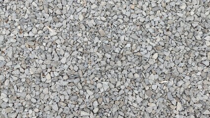 Gravel texture background with small stones in various shades of gray. Ideal for construction,...