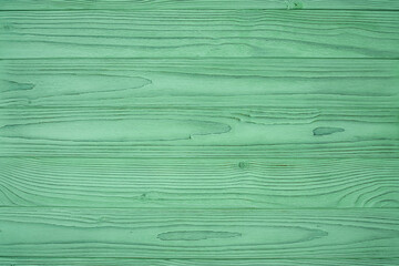 мThe texture of green from old wooden planks arranged in a vertical order. Rough relief texture of natural wood