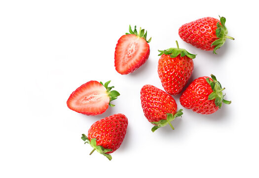 Fresh strawberries with cut in half isolated on white.