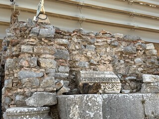 Cat Sleeping on Ancient Marble Column in Ruins