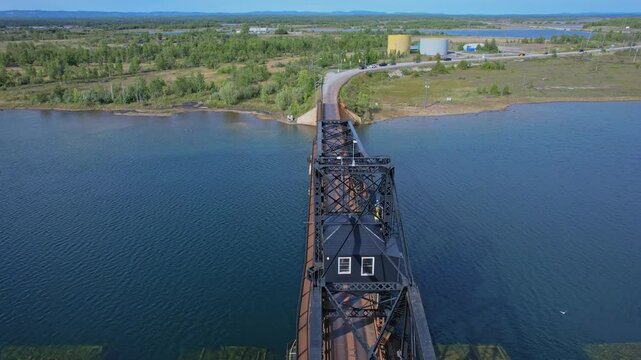 Little current swing bridge at sunny summer with blue sky. The bridge connects Manitoulin island and Goat island to the mainland and use for boats pass.